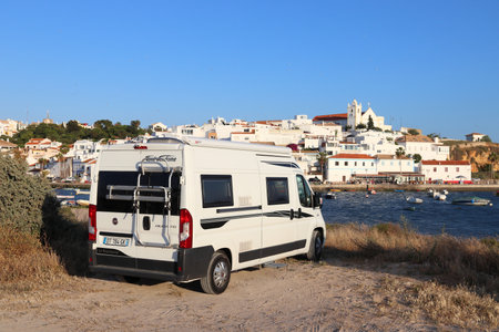 FERRAGUDO, PORTUGAL - JUNE 2, 2018: Camper van (RV) parked in Ferragudo. Coastal region of Algarve attracts more than 17 million tourists annually.のeditorial素材