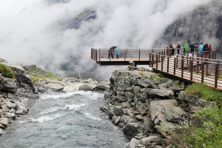 TROLLSTIGEN, NORWAY - JULY 20, 2015: People visit a viewpoint at Trollstigveien, Norway. Foreign tourists spent some 5 million overnight stays in Norway in 2013.のeditorial素材