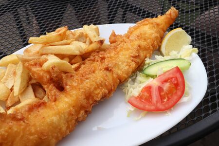 English fish and chips - typical fast food dinner in London.の写真素材