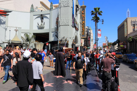 LOS ANGELES, USA - APRIL 5, 2014: People visit Walk of Fame in Hollywood. Hollywood Walk of Fame features more than 2,500 stars with inscribed celebrity names.のeditorial素材