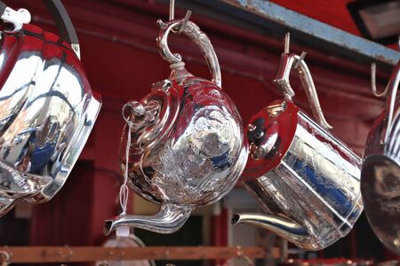 Antique engraved steel teapot at Portobello Road Market in Notting Hill, London.