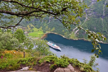 Geiranger Fjord in Norway. Cruise ship in harbor.の写真素材