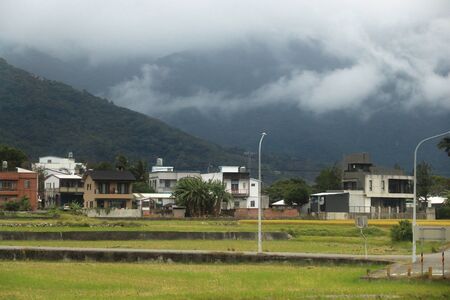 Taiwan countryside landscape. Rice fields and homes of Fuli Township.の写真素材