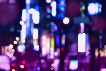 Abstract city lights background. Blurred defocused night neons in Tokyo, Japan.の写真素材