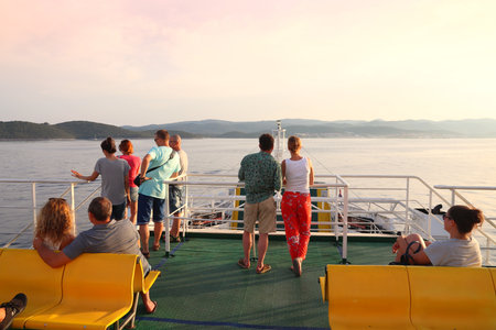 KORCULA, CROATIA - JUNE 22, 2019: Passengers onboard a ferry near Korcula island. Croatia has many...