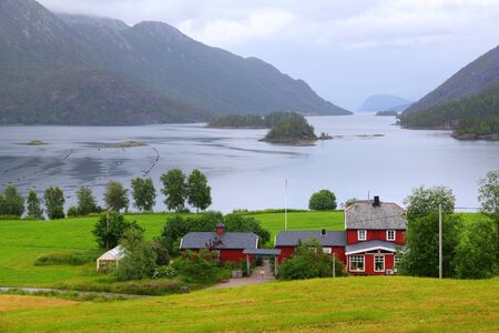 Norway rainy landscape. Bindalsfjorden fiord and countryside of Nordland