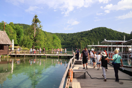 PLITVICE, CROATIA - JUNE 15, 2019: People visit Plitvice Lakes National Park (Plitvicka Jezera) in Croatia. Plitvice is the most popular national park in Croatia with 1.7 million visitors in 2017.のeditorial素材
