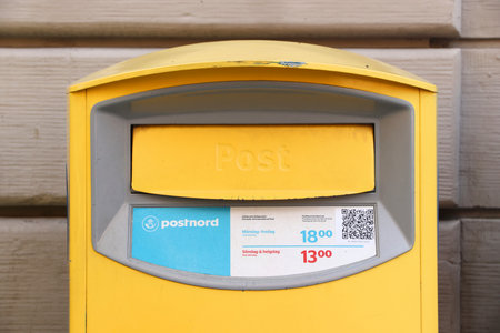 STOCKHOLM, SWEDEN - AUGUST 23, 2018: Postbox in Stockholm, Sweden. PostNord is the merged postal...