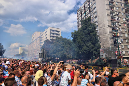 KATOWICE, POLAND - AUGUST 15, 2019: People visit the parade for Armed Forces Day in Katowice, Poland. Fumes pollution from tanks and armored transport vehicles.のeditorial素材