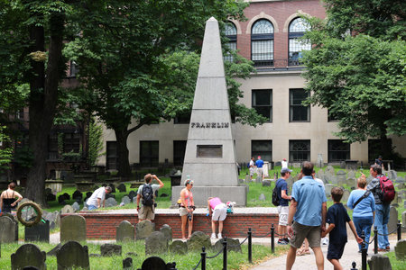 BOSTON, USA - JUNE 9, 2013: People visit Granary Burying Ground in Boston. The cemetery is 3rd oldest in Boston, founded in 1660.のeditorial素材