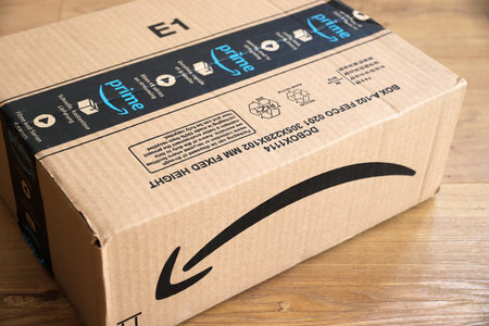 WARSAW, POLAND - AUGUST 23, 2019: Amazon Prime online store order delivered package in Europe. Amazon is considered one of the Big Four global tech companies.のeditorial素材