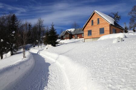 Winter in Poland. Rural road in Zywiec Beskids mountains (Beskid Zywiecki) near Milowka.