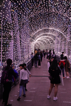 TAIPEI, TAIWAN - DECEMBER 5, 2018: People visit Christmas decorations in Banqiao district of Taipei. Banqiao has an annual impressive light show before Christmas.のeditorial素材