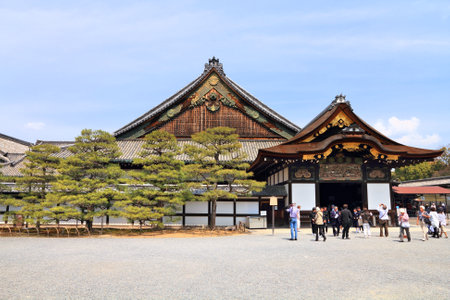 KYOTO, JAPAN - APRIL 19, 2012: Tourists visit Nijo Castle in Kyoto, Japan. Old Kyoto is a UNESCO World Heritage site and was visited by almost 1 million foreign tourists in 2010.のeditorial素材
