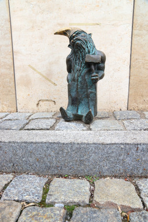 WROCLAW, POLAND - MAY 11, 2018: Gnome or dwarf - small statue in Wroclaw, Poland. Wroclaw has 350 gnome sculptures around the city.のeditorial素材