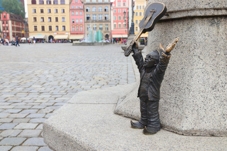 WROCLAW, POLAND - MAY 11, 2018: Gnome or dwarf with a guitar - small statue in Wroclaw, Poland. Wroclaw has 350 gnome sculptures around the city.のeditorial素材