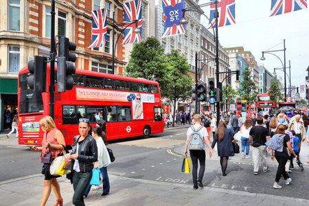 LONDON, UK - JULY 7, 2016: People shop at Oxford Street in London. Oxford Street (crossing Oxford Circus) has approximately half a million daily visitors and 320 stores.のeditorial素材