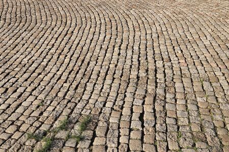 Stone paving background - granite cobblestone pattern in Chemnitz city, Germany.