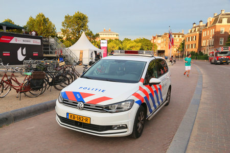 AMSTERDAM, NETHERLANDS - JULY 9, 2017: Police car in Amsterdam, Netherlands. Police (Politie) employs more than 63,000 people in the Netherlands.のeditorial素材
