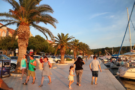 MAKARSKA, CROATIA - JUNE 21, 2019: People visit the harbor promenade in Makarska, Croatia. Croatia had 18.4 million tourist visitors in 2018.のeditorial素材
