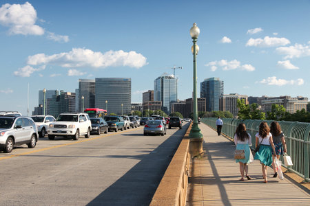 WASHINGTON, USA - JUNE 14, 2013: People cross Key Bridge in downtown Washington, DC. 65 percent of households in Washington DC own a car.のeditorial素材