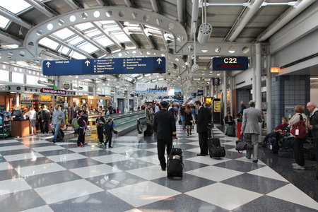 CHICAGO, USA - APRIL 1, 2014: Pilots walk to gate at Chicago O'Hare International Airport in USA. It was the 5th busiest airport in the world with 66,883,271 passengers in 2013.のeditorial素材