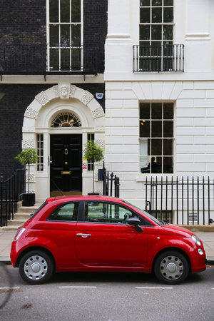 LONDON, UK - JULY 6, 2016: Fiat 500 small city car parked in London, UK. There are 2.6m cars registered in London.のeditorial素材