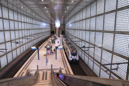 LEIPZIG, GERMANY - MAY 9, 2018: Passengers wait at Wilhelm-Leuschner-Platz local train station in Leipzig, Germany.のeditorial素材