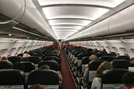 MANILA, PHILIPPINES - DECEMBER 6, 2017: Passengers fly onboard low cost airline Air Asia Airbus A320 en route from Puerto Princesa to Manila, Philippines.のeditorial素材