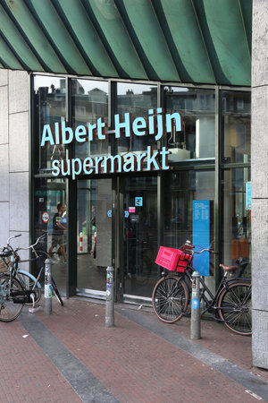 AMSTERDAM, NETHERLANDS - JULY 9, 2017: Customers visit Albert Heijn supermarket in Amsterdam. Sales turnover of supermarkets in Netherlands has grown 32 percent in years 2006-2016.のeditorial素材