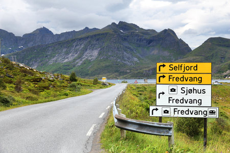 LOFOTEN, NORWAY - JULY 19, 2015: Directions sign in Lofoten islands, Norway. Norway had almost 5 million foreign visitors in 2011.のeditorial素材
