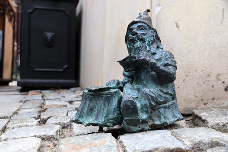 WROCLAW, POLAND - MAY 11, 2018: Gnome or dwarf small statue in Wroclaw, Poland. Wroclaw has 350 gnome sculptures around the city.のeditorial素材