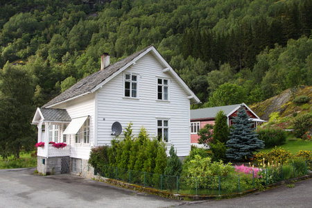 VESTLAND, NORWAY - AUGUST 13, 2010: Generic residential building, wooden house in Vestland, Norway, seen from public street. Average property price in 2019 in Norway was 398,000 USD.のeditorial素材