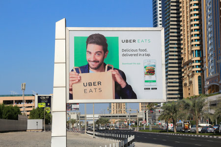 DUBAI, UAE - NOVEMBER 22, 2017: Billboard advertisement of Uber Eats food delivery service app in Dubai city, United Arab Emirates.のeditorial素材