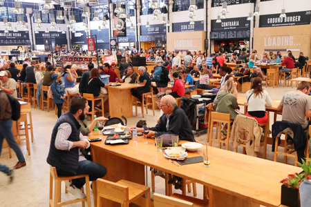 LISBON, PORTUGAL - JUNE 6, 2018: People eat at TimeOut Market in Lisbon, Portugal. TimeOut Market is...