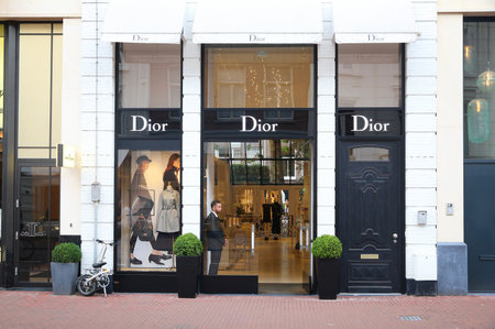 AMSTERDAM, NETHERLANDS - JULY 10, 2017: Dior high fashion shop at PC Hooftstraat in Amsterdam. Pieter Cornelis Hooftstraat is the ultimate upscale shopping street in the Netherlands.のeditorial素材