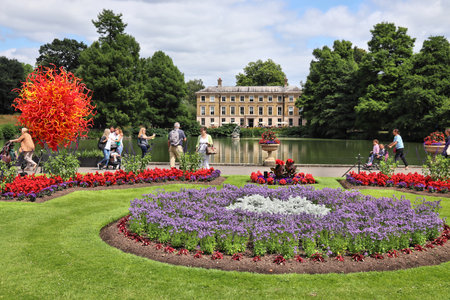 KEW, UK - JULY 15, 2019: People visit Kew Gardens in Greater London. Royal Botanic Gardens are designated as UNESCO World Heritage Site.のeditorial素材