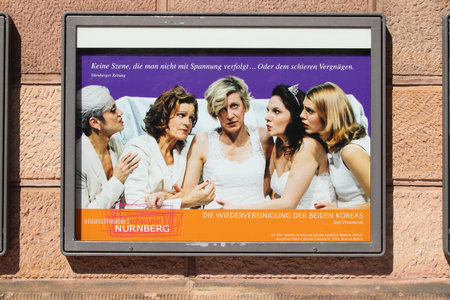 NUREMBERG, GERMANY - MAY 7, 2018: Poster promoting theater play in Staatstheater Nurnberg (State Theater of Nuremberg) in Germany. The theater opened in 1905.のeditorial素材