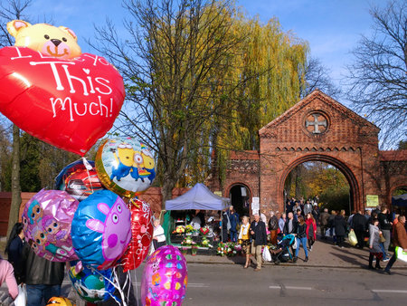 BYTOM, POLAND - NOVEMBER 1, 2018: People visit graves during All Saints Day in Bytom. All Saints Day celebrations at cemeteries is one of most important cultural event in Poland.のeditorial素材
