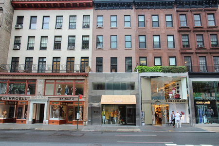 NEW YORK, USA - JULY 1, 2013: People visit fashion stores along Madison Avenue, New York. Madison Avenue is one of the most recognized fashion shopping destination in the world.のeditorial素材