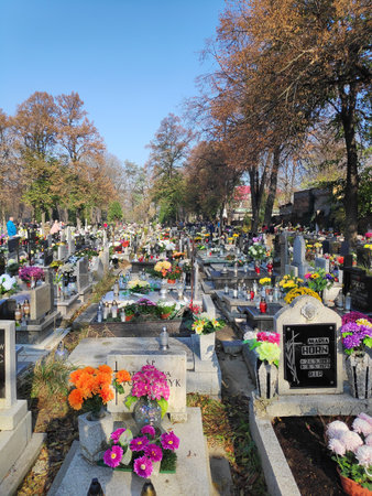 BYTOM, POLAND - NOVEMBER 1, 2019: People visit cemetery during All Saints Day in Bytom. All Saints Day celebrations at cemeteries is one of most important cultural event in Poland.のeditorial素材