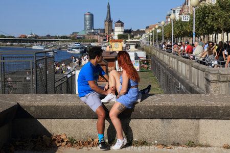 DUSSELDORF, GERMANY - SEPTEMBER 19, 2020: People visit river Rhine waterfront in Dusseldorf, Germany. Dusseldorf is the 7th largest city in Germany by population.のeditorial素材