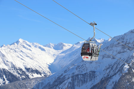 MAYRHOFEN, AUSTRIA - MARCH 12, 2019: People visit Mayrhofen ski resort in Tyrol region, Austria. The resort is located in Zillertal valley of Central Eastern Alps (Zentralalpen).のeditorial素材