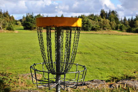Disc golf course basket in Norway. Rare outdoor sport.の写真素材