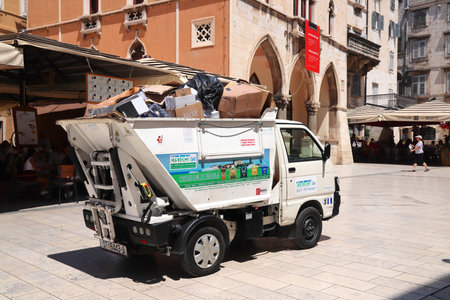 SPLIT, CROATIA - JULY 20, 2019: Small garbage management truck operating in Split, Croatia.のeditorial素材