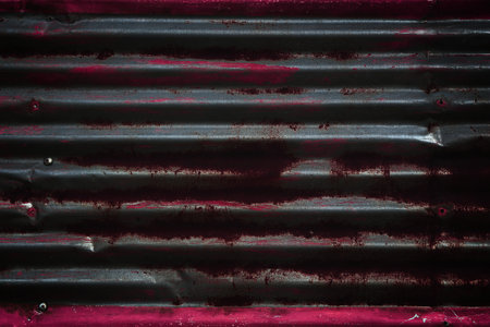 Dark distressed metal texture. Black grungy metal background.の写真素材
