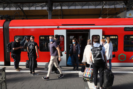 KREFELD, GERMANY - SEPTEMBER 18, 2020: People exit train at railway station Hauptbahnhof in Krefeld,...