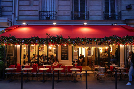 PARIS, FRANCE - DECEMBER 10, 2019: People visit local bistro in 7th Arrondissement of Paris, France. Paris is the biggest city in France, with 12.5 million people living in its metro area.のeditorial素材