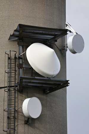 Cell tower base station microwave directional antennas. Mobile 5G transmitter equipment.