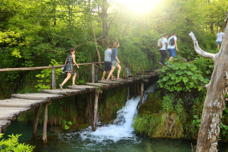 PLITVICE, CROATIA - JUNE 15, 2019: People visit Plitvice Lakes National Park (Plitvicka Jezera) in Croatia. Plitvice is the most popular national park in Croatia with 1.7 million visitors in 2017.のeditorial素材